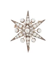 A DIAMOND STAR BROOCH