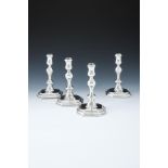 A MATCHED SET OF FOUR QUEEN ANNE AND GEORGE I SILVER OCTAGONAL CANDLESTICKS