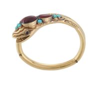 A LATE 19TH CENTURY GARNET AND TURQUOISE SERPENT BANGLE, CIRCA 1880