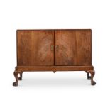 A GEORGE I WALNUT CABINET ON STAND, CIRCA 1720