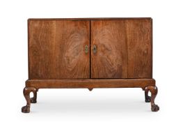 A GEORGE I WALNUT CABINET ON STAND, CIRCA 1720