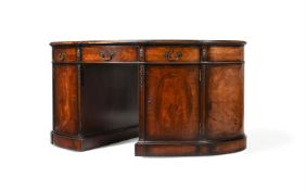 AN EDWARDIAN MAHOGANY, CROSS BANDED, AND LINE INLAID OVAL PEDESTAL DESK, CIRCA 1905