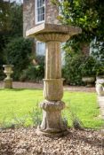 A VICTORIAN STONE COMPOSITION BIRD BATH, IN THE MANNER OF AUSTIN & SEELEY, 19TH CENTURY