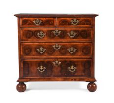 A QUEEN ANNE OLIVEWOOD, WALNUT, FRUITWOOD OYSTER VENEERED AND FEATHER-BANDED CHEST OF DRAWERS