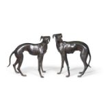 A PAIR OF LIFE SIZE CAST BRONZE MODELS OF WHIPPETS, 20TH CENTURY