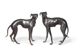 A PAIR OF LIFE SIZE CAST BRONZE MODELS OF WHIPPETS, 20TH CENTURY