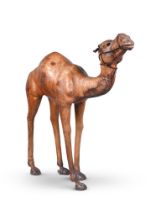 A LARGE LEATHER MODEL OF A CAMEL, LATE 19TH OR EARLY 20TH CENTURY