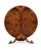 A VICTORIAN FIGURED WALNUT AND CARVED WALNUT CENTRE TABLE, IN THE MANNER OF HOLLAND & SONS