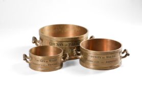 A SET OF THREE LATE VICTORIAN BRASS ALLOY IMPERIAL MEASURES FOR THE COUNTY OF WILTSHIRE