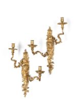 A PAIR OF LOUIS XV GILT BRONZE TWIN-BRANCH WALL LIGHTS MODELLED WITH ZEPHYR, CIRCA 1745-1749