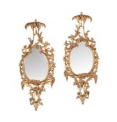 A PAIR OF CARVED GILTWOOD MIRRORS, IN THE MANNER OF THOMAS JOHNSON, 20TH CENTURY