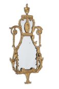 A GEORGE III CARVED GILTWOOD MIRROR, AFTER DESIGNS BY ROBERT ADAM, CIRCA 1780