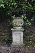 A STONE COMPOSITION URN ON PLINTH, 20TH CENTURY