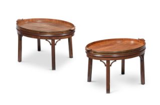 A PAIR OF GEORGE III MAHOGANY AND BRASS BOUND TRAYS ON LATER STANDS, THE TRAYS CIRCA 1780