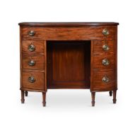 A GEORGE III MAHOGANY BOWFRONT DRESSING TABLE, AFTER DESIGNS BY THOMAS SHERATON, CIRCA 1800