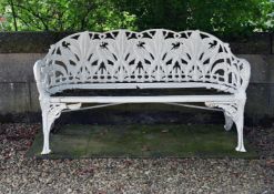 A WHITE PAINTED CAST IRON BENCH OF 'LILY OF THE VALLEY' TYPE, AFTER COALBROOKDALE