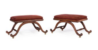 A PAIR OF REGENCY BEECH, PARCEL GILT AND GILT METAL MOUNTED STOOLS, IN THE MANNER OF GILLOWS
