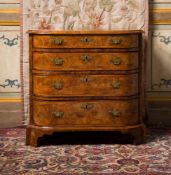 A GEORGE II BURR AND FIGURED WALNUT CHEST OF DRAWERS, CIRCA 1740