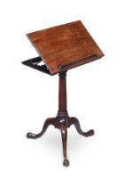 A GEORGE II MAHOGANY ADJUSTABLE READING TABLE, CIRCA 1750