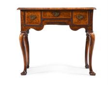A GEORGE II WALNUT AND ASH FEATHER BANDED SIDE TABLE, CIRCA 1730