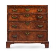 A GEORGE II WALNUT AND FEATHER BANDED BACHELOR'S CHEST OF DRAWERS, MID 18TH CENTURY