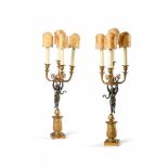 A PAIR OF EMPIRE REVIVAL BRONZE AND GILT METAL CUPID CANDELABRA, FRENCH, CIRCA 1860-1900