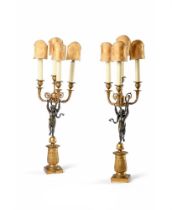 A PAIR OF EMPIRE REVIVAL BRONZE AND GILT METAL CUPID CANDELABRA, FRENCH, CIRCA 1860-1900