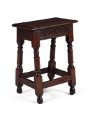 A COMMONWEALTH CARVED OAK JOINT STOOL, MID 17TH CENTURY