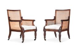 A PAIR OF REGENCY MAHOGANY BERGERE LIBRARY ARMCHAIRS, ATTRIBUTED TO GILLOWS, CIRCA 1815