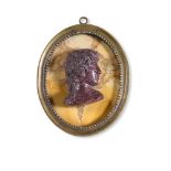 A GRAND TOUR PORPHYRY PORTRAIT CAMEO, PROBABLY ANTINOUS, IN THE LATE 18TH CENTURY MANNER