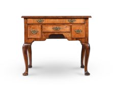 A GEORGE I WALNUT AND FEATHER BANDED SIDE TABLE, CIRCA 1720