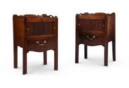A CLOSELY MATCHED PAIR OF GEORGE III MAHOGANY BEDSIDE CUPBOARDS, CIRCA 1780