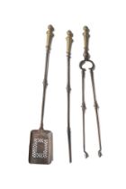 A SET OF THREE STEEL AND GILT METAL FIRE TOOLS, EARLY 19TH CENTURY