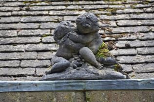 A STONE COMPOSITION MODEL OF TWO PUTTI20TH CENTURY50cm high