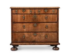 A QUEEN ANNE WALNUT AND HOLLY STRUNG CHEST OF DRAWERS, CIRCA 1710