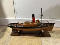 A MODEL OF A LIVE STEAM POWERED TUGBOAT 'BENMORE' EARLY 20TH CENTURYWith fitted mast