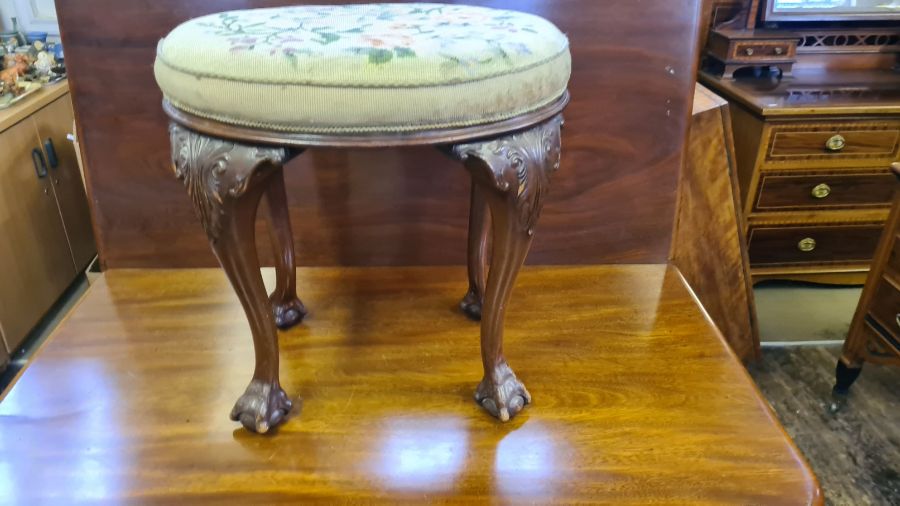 Mid Victorian tall carved cabriole legged foot stool with ball and claw feet with oval woolwork