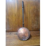 Victorian copper warming pan with pierced and engraved lid and turned hardwood handle.
