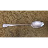 A large Georgian silver serving spoon