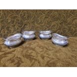 A set of 4 wrythen embossed silver salts