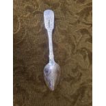 A Russian silver spoon with engraved decoration