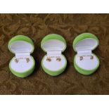 3 pairs of 9ct gold stud earrings in apple cases