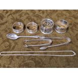 Silver napkin rings, spoon, sugar nips and chain