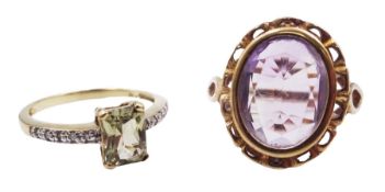 Gold oval amethyst ring with openwork gallery and a gold stone set ring