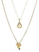 Gold single stone pearl and diamond pendant necklace and a gold sapphire leaf pendant necklace