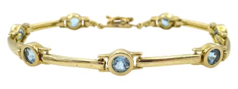 9ct gold circular blue topaz bar link bracelet