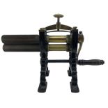 Victorian cuff and collar table top mangle with ribbed brass rollers in a cast iron frame with turne