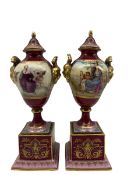 Pair of late 19th/20th century 'Vienna' porcelain vases with covers and stands decorated with panels