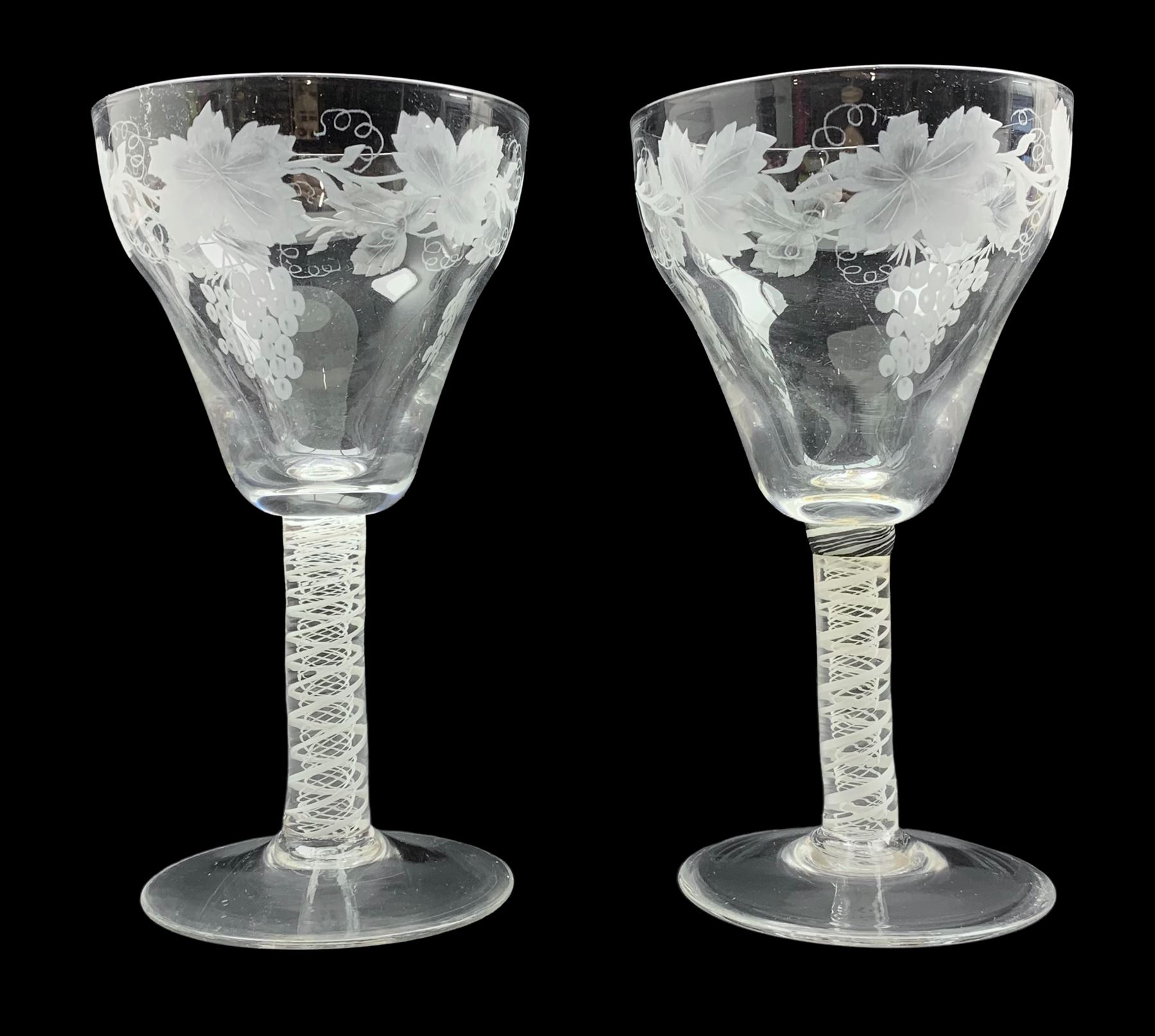 Pair of 19th century vine-decorated claret glasses with ogee bowls and cotton twist stems (one stem