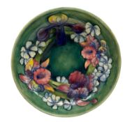 Walter Moorcroft Orchid pattern bowl on a green wash ground